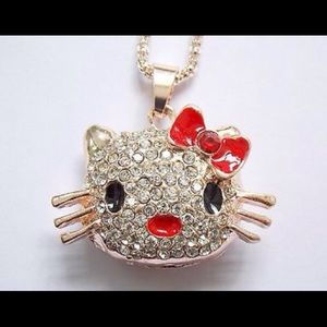 Red and black enamel Betsey Johnson kitty pendant.